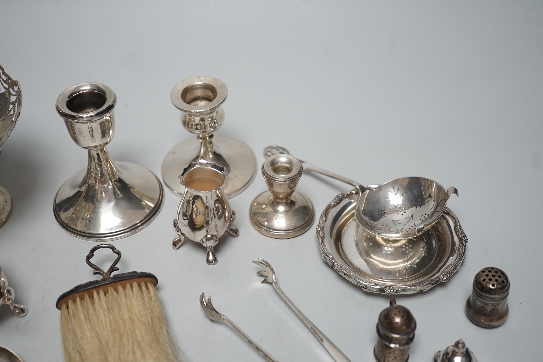 Sundry small silver including four salts by Mappin & Webb, three mounted dwarf candlesticks, two white metal Egyptian dishes and a white metal tazza, eight other items including two 19th century caddy spoons and four pla